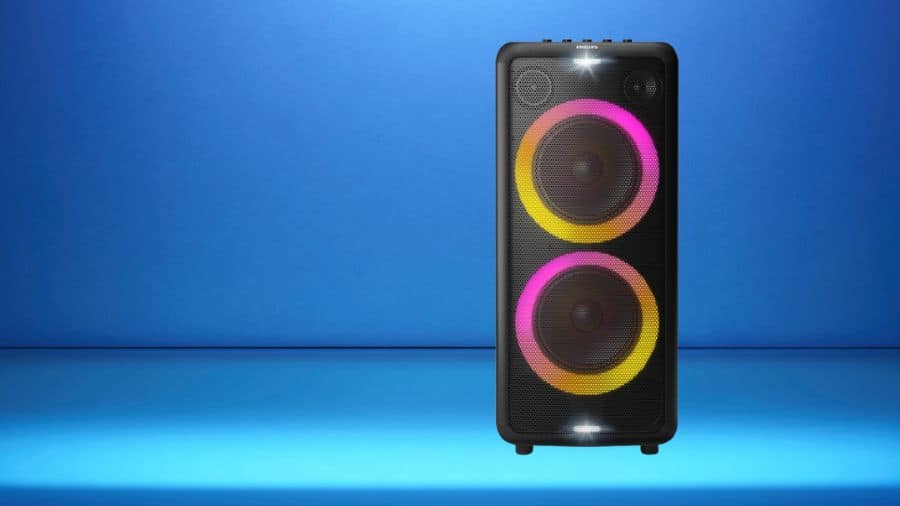 Imagem da caixa de som Bluetooth Philips TAX5208/78 em ambiente iluminado com fundo azul